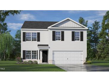 Charming two-story home featuring a classic white facade, black shutters, and an attached two-car garage at 214 Oak Barrel St, Smithfield, NC 27577