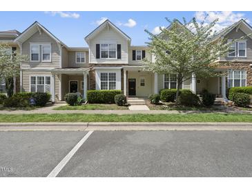 Charming townhomes featuring lush landscaping, stone accents, and inviting entryways at 4210 Brynwood Ave, Durham, NC 27713