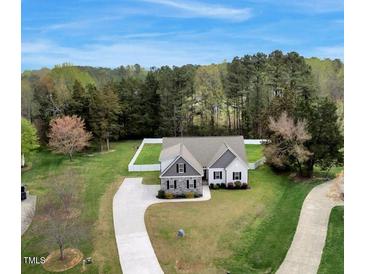 Charming single-Gathering home with a well-manicured lawn and mature trees at 4304 S Greg Allen Way, Oxford, NC 27565