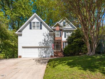 Charming two-story home with a well-manicured lawn and a beautiful shade tree in a desirable neighborhood at 6909 Clear Sailing Ln, Raleigh, NC 27615