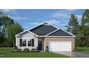 Charming single-story home with a brick and siding exterior and a two-car garage at 1014 Middlecrest Dr, Rocky Mount, NC 27804