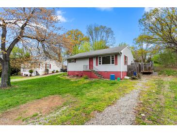 Charming single-story home featuring red brick foundation and a well-maintained front yard at 229 Watson Dr, Burlington, NC 27217