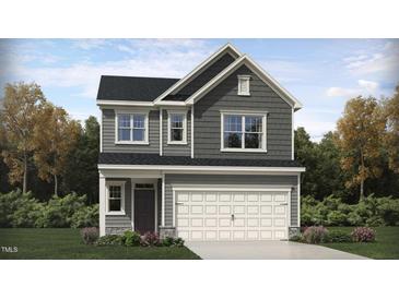 Charming two-story home with gray siding, white trim, and an attached two-car garage at 765 Swim Cave Ln, Wendell, NC 27591