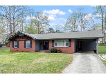 Charming one-story brick house with a well-maintained lawn and cozy carport at 1813 Grady Dr, Durham, NC 27712