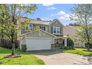 Charming two-story home with a two-car garage, stone accents, and well-maintained landscaping at 617 Conover Rd, Durham, NC 27703