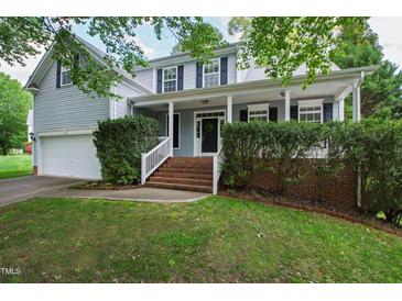 Charming home with a cozy front porch, well-maintained lawn and brick stairway at 704 Voyager Pl, Durham, NC 27712