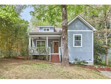 Charming home featuring light blue siding, front porch, and mature trees at 2814 Sarah Ave, Durham, NC 27707