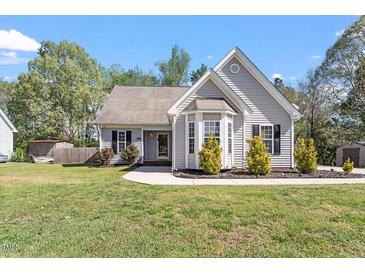 Charming single-Gathering home with well-manicured lawn and bay window at 310 Cedarhurst Ln, Franklinton, NC 27525