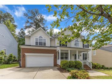 Charming two-story home with a brick-accented garage and landscaped front yard at 2002 Patapsco Dr, Apex, NC 27523