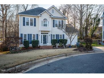 Charming two-story home featuring blue shutters, manicured landscaping, and a welcoming front entrance at 3100 Benton Cir, Raleigh, NC 27615