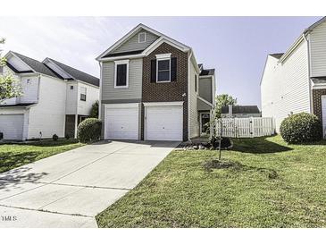 Charming two-story home featuring a well-manicured lawn and a two-car garage at 7528 Argent Valley Dr, Raleigh, NC 27616