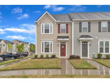 A charming two-story home with well-maintained landscaping and a welcoming front entrance at 8601 Red Canyon Way, Raleigh, NC 27616