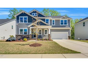 Charming two-story home featuring stone accents, neutral siding and a two car attached garage at 105 Scoville Rd, Garner, NC 27529