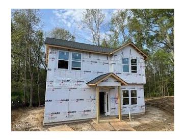 New construction shows the front of the home before siding and paint at 12 Gates St, Roxboro, NC 27573
