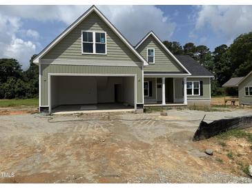 Charming home featuring a two-car garage and pleasant curb appeal at 125 Tee Dr, Selma, NC 27576