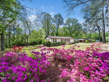 Charming single-story home with colorful azaleas in the front yard at 1301 Lynnwood Rd, Knightdale, NC 27545