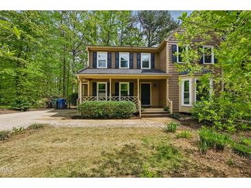 Charming two-story home featuring a welcoming front porch and well-maintained landscaping at 5610 Frenchmans Creek Dr, Durham, NC 27713
