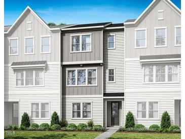 New construction townhome featuring two-story with gray and white color palette and inviting front yard at 1029 Zelkova Ln, Chapel Hill, NC 27517