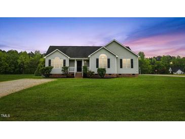 Charming single-story home with a well-maintained lawn and inviting curb appeal at 16 Monarch Trl, Selma, NC 27576