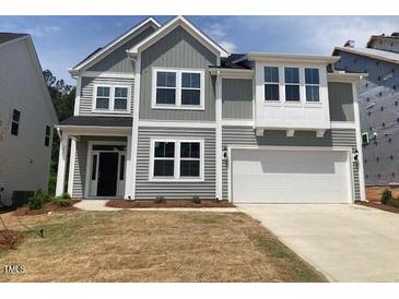 Charming two-story home with gray siding, white trim, and a two-car garage at 246 N Maple Walk Dr # 230, Garner, NC 27529