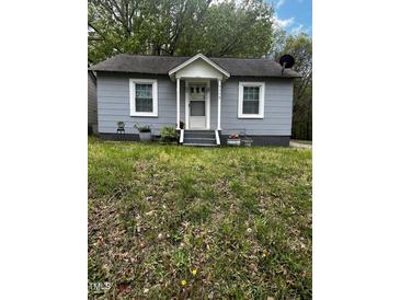 Charming single-story home with a welcoming front porch and tidy landscaping at 5116 Nc 56 Hwy, Franklinton, NC 27525