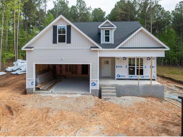 Charming new construction with a two-car garage and bright, airy windows at 90 Purslane Dr, Franklinton, NC 27525