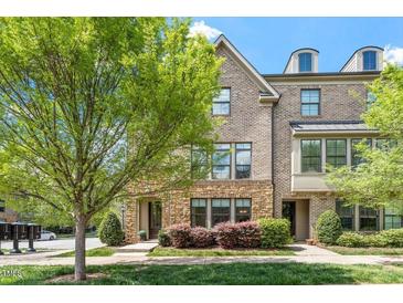 Charming brick townhome with stone accents and manicured landscaping at 1601 Bowery Dr, Raleigh, NC 27607