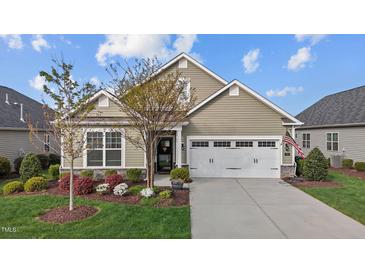 Charming single-Gathering home features a well-manicured lawn, two car garage and beautiful landscaping at 252 Tyree Trl, Burlington, NC 27215