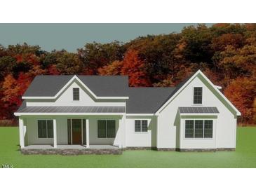 Charming new construction home with a welcoming front porch and craftsman details at 435 Pilot Ridge Rd, Zebulon, NC 27597