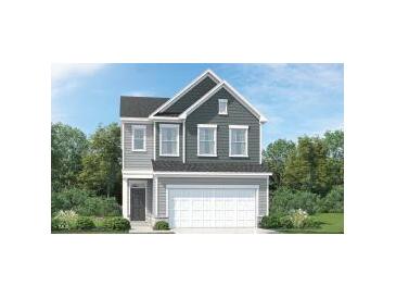 Charming two-story home with gray siding and a prominent two-car garage in a well-maintained community at 525 Morning Light Dr # 31, Angier, NC 27501