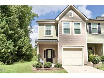Charming townhouse features a well-kept lawn and a convenient one-car garage at 4901 Rose Quartz Way, Raleigh, NC 27610