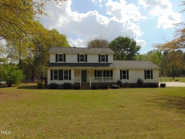 Charming two-story home with manicured lawn and traditional curb appeal in a peaceful, tree-lined neighborhood at 5531 Autry Rd, Rocky Mount, NC 27803