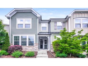 Charming townhome with stone accents, landscaped front yard, and inviting entryway at 1817 Shady Oaks Dr, Wendell, NC 27591