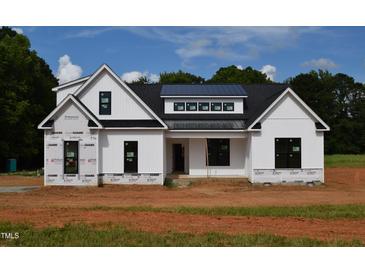 New construction home featuring a modern farmhouse design with black window frames at 4330 Medicus Ln, Franklinton, NC 27525