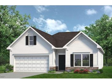 Charming single-Gathering home showcasing white siding, a two-car garage, and tasteful stone accents at 52 E American Marigold Dr # 63, Benson, NC 27504