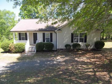 Charming one-story home featuring a cozy front porch and mature trees at 164 Sue Dr, Angier, NC 27501