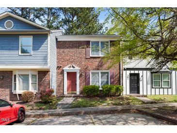 Charming brick townhome with manicured landscaping, offering a warm and inviting curb appeal at 359 Kilarney Dr, Durham, NC 27703