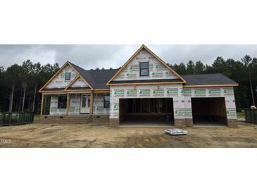 New construction home featuring a two-car garage and covered porch at 115 Sanders Farm Dr, Smithfield, NC 27577