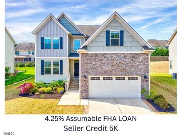 Beautiful two-story home featuring a stone facade and a two-car garage at 3338 Prospect Parkway Pkwy, Durham, NC 27703
