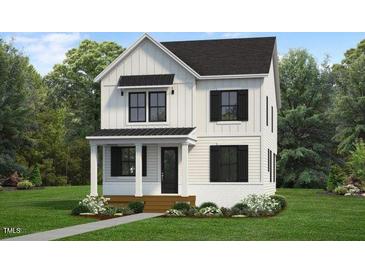 Charming two-story home with a modern farmhouse style and inviting front porch at 1348 Hurston Ln, Knightdale, NC 27545