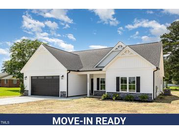 Charming exterior showcasing the craftsman style of this move-in ready new construction at 1008 Peedin Rd, Selma, NC 27576