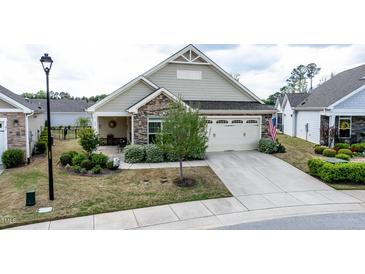 Charming one-story home with a stone facade, two-car garage, and well-maintained landscaping at 37 Blue Spruce Cir, Clayton, NC 27527