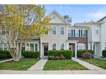 Charming townhome with well-maintained landscaping and classic architectural details at 140 Cedar Elm Rd, Durham, NC 27713