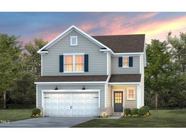 Charming two-story home with gray siding, a two-car garage, and manicured landscaping at 437 Providence Springs Ln, Fuquay Varina, NC 27526
