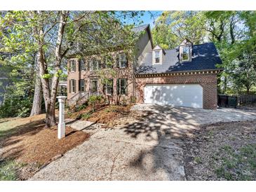 Charming two-story brick home with a well-maintained yard and inviting curb appeal at 510 Guy Walker Way, Durham, NC 27703