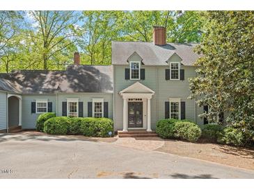 Charming two-story home with manicured landscaping and a welcoming front entrance at 605 Glen Eden Dr, Raleigh, NC 27612