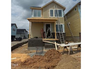 New home under construction featuring a brick foundation and a partially-built front porch at 10 Relaxing Way, Pittsboro, NC 27312