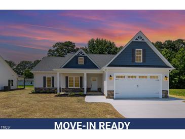 Inviting, move-in ready home with charming architectural details and a well-manicured lawn at 1000 Peedin Rd, Selma, NC 27576