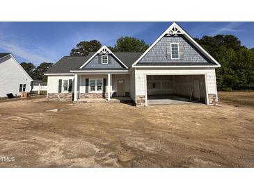 Charming single-Gathering home with an attached garage, complemented by a beautifully designed elevation at 1000 Peedin Rd, Selma, NC 27576