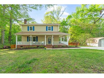 Charming two-story home with a covered front porch and well-maintained lawn at 2004 Valley Ridge Ct, Raleigh, NC 27603